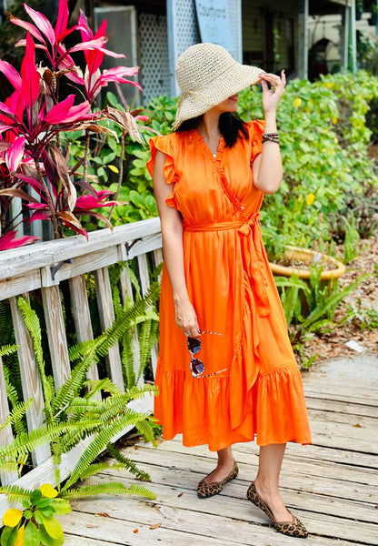 Model wearing Frnch Summer orange dress