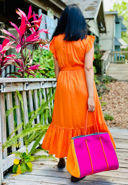 Back of Model wearing Frnch Summer orange dress