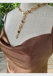 Gorgeous knit top in sparkling metallic copper color. Cowl neck and thin straps. 